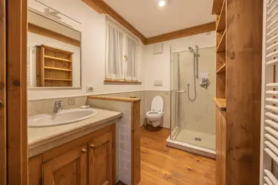 a bathroom with a sink and a toilet at Casa Bucaneve 2, confortevole a due passi dal centro in Cortina dʼAmpezzo