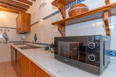 a bathroom with a sink and a shower at Sunshine Home in Caprile