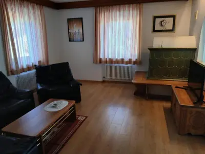 a living room with a couch and a table at Casa Soppelsa 1 in Moena