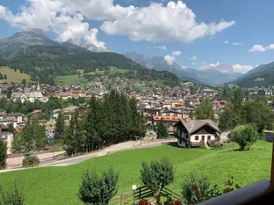 a view of a town in the mountains at Casa Soppelsa 1 in Moena