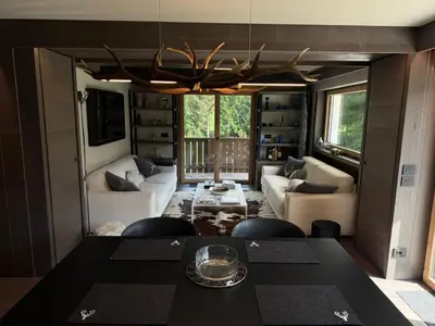 a living room with a couch and a table at Dimora Alverà 19 in Cortina dʼAmpezzo