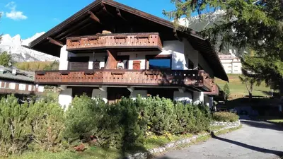 a building with a lot of rusteditures on it at Apartment with Dolomites view in Cortina dʼAmpezzo