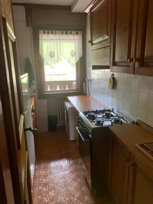 a kitchen with a stove and a window at Apartment with Dolomites view in Cortina dʼAmpezzo