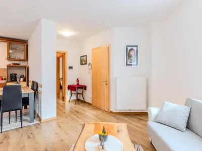 a living room with a couch and a table at Apartment Relax tra i Monti by Interhome in Livo
