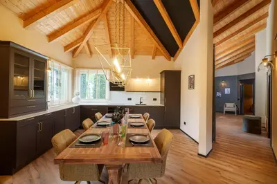 a large dining room with a long table and chairs at Villa Ilaria in Lagundo