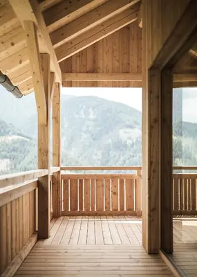 a wooden room with a view of a mountain at Zalnerhof Urlaub am Bauernhof in Luson
