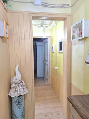 a hallway leading into a room with a door at Alessandra's House Mountain in Masarè