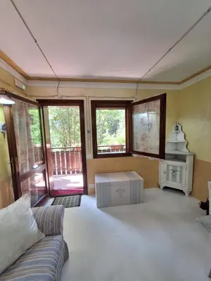 a living room with a couch and a table at Alessandra's House Mountain in Masarè