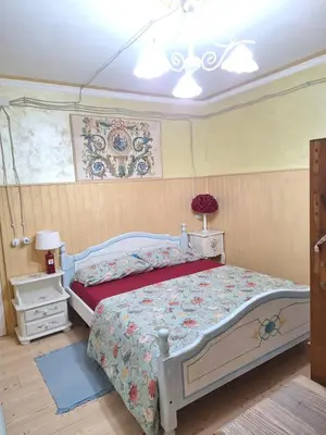 a bedroom with a bed and a window at Alessandra's House Mountain in Masarè