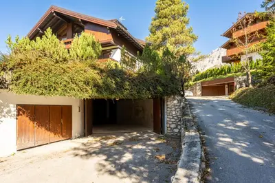 a driveway of a house with a garage at Villa Allegra Mountain view in Cortina dʼAmpezzo