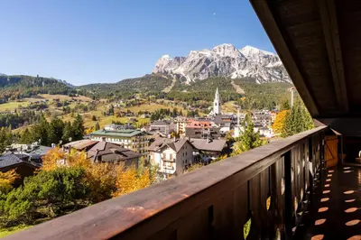 a view from a balcony of a town and mountains at Villa Allegra Mountain view in Cortina dʼAmpezzo