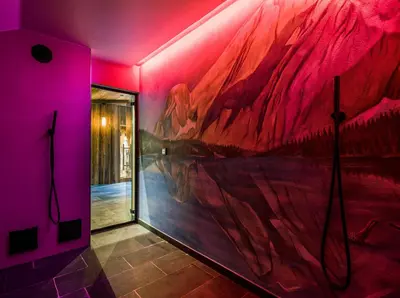 a pink room with a painting on the wall at Apartment Vernel in Santa Cristina in Val Gardena