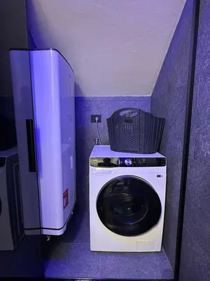 a washing machine with a basket on top of it at Cèsa Sabrina in Moena