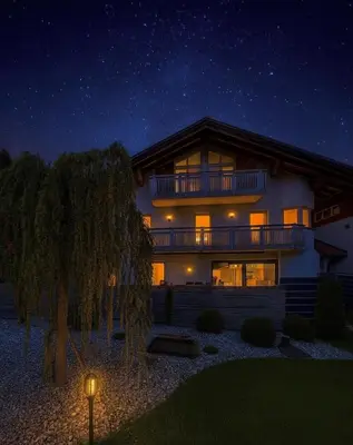a large house at night with a starry sky at Erika Suites & Lofts Chalet in Stanghe
