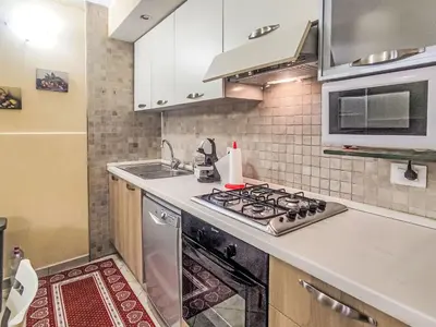 a kitchen with a stove and a sink at Apartment Ciasa Tella by Interhome in Moena