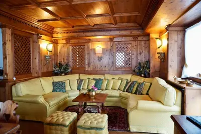 a living room with a couch and a table at Alverà Luxury apartment - centro Cortina d'Ampezzo in Cortina dʼAmpezzo