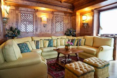 a living room with couches and a table at Alverà Luxury apartment - centro Cortina d'Ampezzo in Cortina dʼAmpezzo