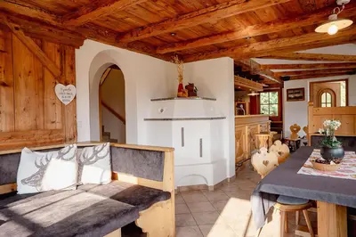 a living room with a bed and a table at Ferienhaus Morx Puite in Moso
