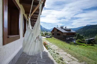 a white bag hanging from the side of a house at Ruoibes 17 in San Vito di Cadore