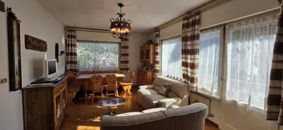 a living room with a couch and a dining room at Casa Scacciapensieri in Pera