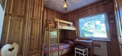 a bedroom with two bunk beds and a window at Casa Scacciapensieri in Pera