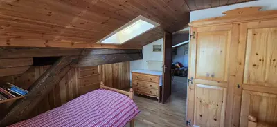 a bedroom with a bed and a wooden ceiling at Casa Scacciapensieri in Pera