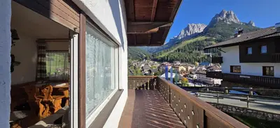 a balcony with a view of a town and mountains at Casa Scacciapensieri in Pera