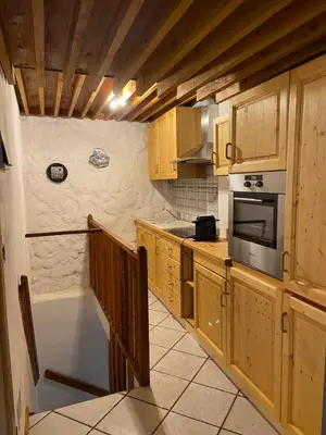 a kitchen with a tub and a stove top oven at Ciasablè in Fondo