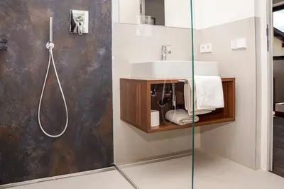 a bathroom with a sink and a shower at Appartements Laimer in Haslach in Tirolo
