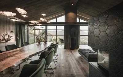 a conference room with a long table and chairs at Chalet Altera by Elite Villas in Ortisei