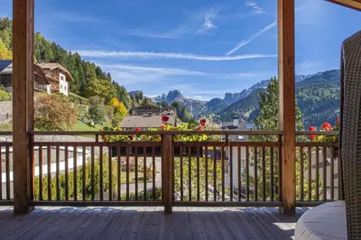 a balcony with a view of the mountains at Mayr Natur Apartments in Santa Cristina in Val Gardena