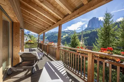 a balcony with a view of a mountain at Mayr Natur Apartments in Santa Cristina in Val Gardena