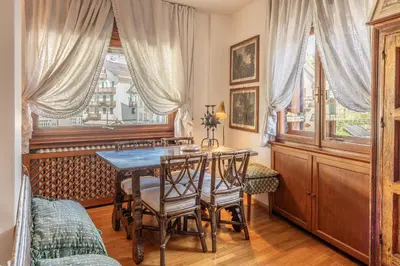 a dining room with a table and chairs at Casa Bigontina 19, in the center of Cortina in Cortina dʼAmpezzo