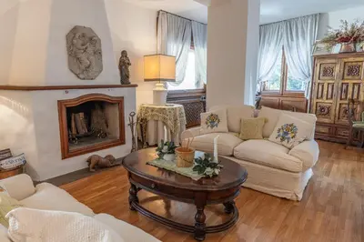 a living room with a couch and a table at Casa Bigontina 19, in the center of Cortina in Cortina dʼAmpezzo