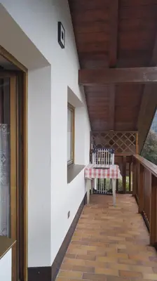 a hallway of a house with a wooden ceiling at Lauton Dolomiti Relax Apartment - mit Jacuzzi-Badewanne in Ziano di Fiemme