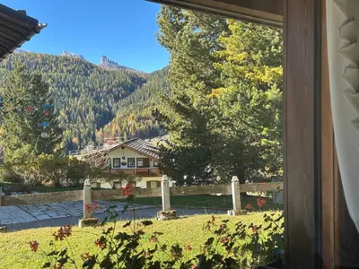 a view from a window of a house with a mountain at Appartamento 5 Torri - Dolce Vita Stay in Cortina dʼAmpezzo
