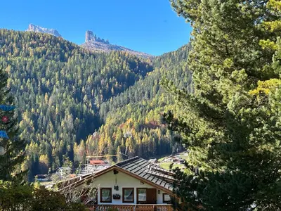 a house on the side of a mountain at Appartamento 5 Torri - Dolce Vita Stay in Cortina dʼAmpezzo
