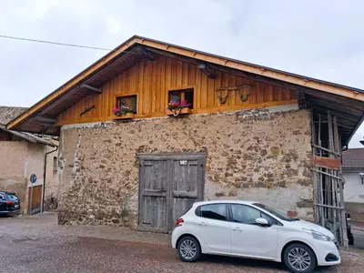 a white car parked in front of a building at Casa Bruna by Go New Location in Varena