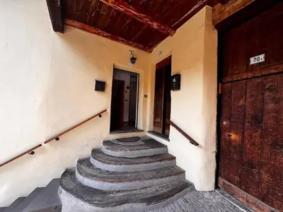 a group of stairs in a building with a door at Appartamento Town Center in Predazzo