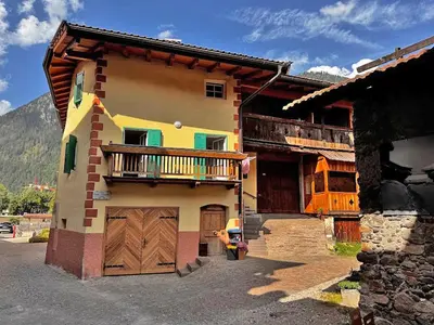 an open window with a view of a building at Appartamento Town Center in Predazzo