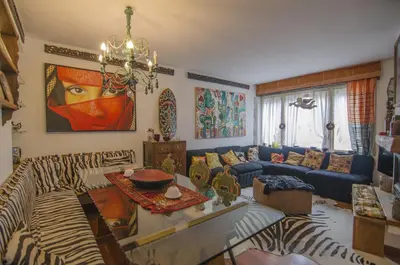 a living room with a couch and a zebra print rug at Casa Cristallo in Cortina dʼAmpezzo
