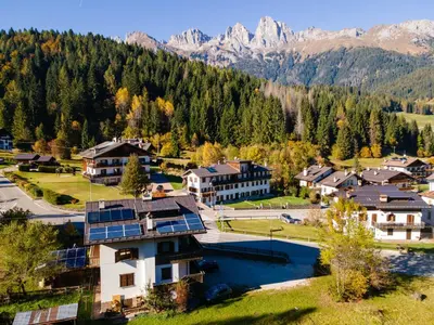 an aerial view of a resort with mountains in the background at Casa Sangi in Caviola