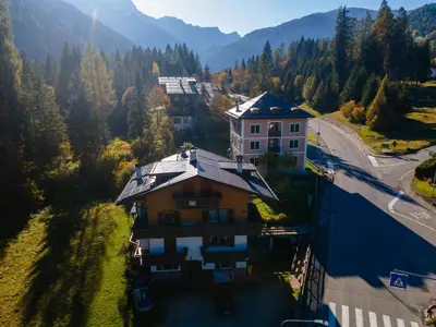 an aerial view of a house in the mountains at Casa Sangi in Caviola
