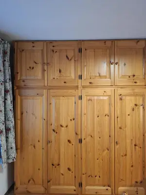 a wooden closet with wooden cabinets in a room at Appartamenti - Sass de Stria Cernadoi Dolomiti in Andraz