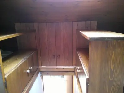 an empty cabin with wooden walls and wooden shelves at Cortina central apartment overlooking Tofane Faloria in Cortina dʼAmpezzo