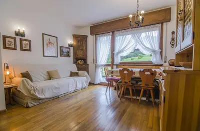 a living room with a couch and a table at Ca Masarie in Alvera
