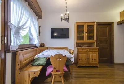 a dining room with a table and a window at Ca Masarie in Alvera