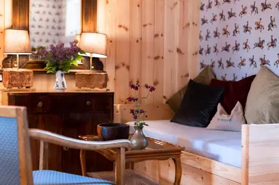 a bedroom with a bed and a table with a chair at Wohnung GEORG-OTTO in Soprabolzano