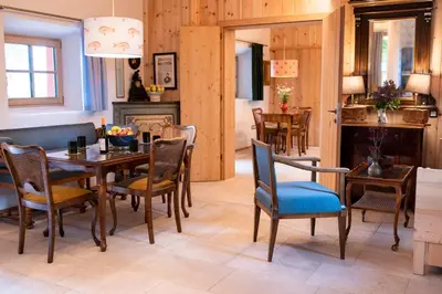 a dining room with a table and chairs at Wohnung GEORG-OTTO in Soprabolzano