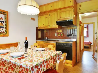 a kitchen with a table with a table cloth at Apartment Apt 1 by Interhome in Penia
